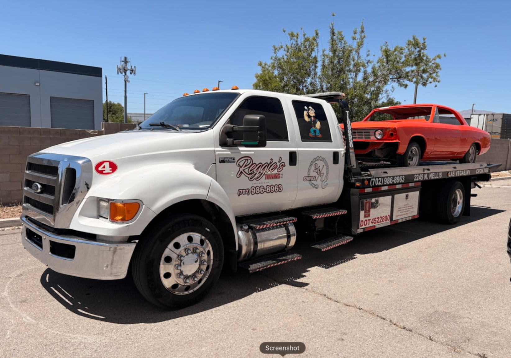 Classic orange muscle car on Reggie's flatbed